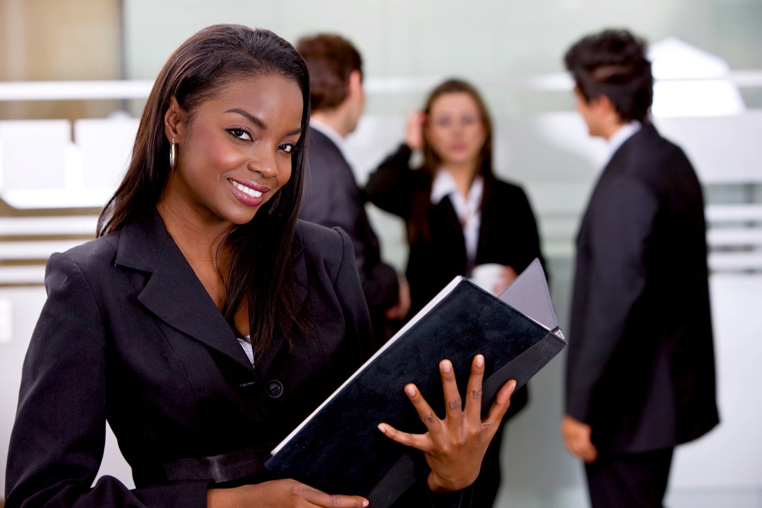 Portrait of a Professional Woman Holding a Folder 